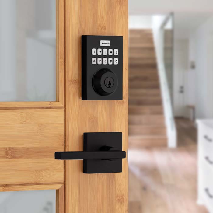 Kwikset smart lock on wood door